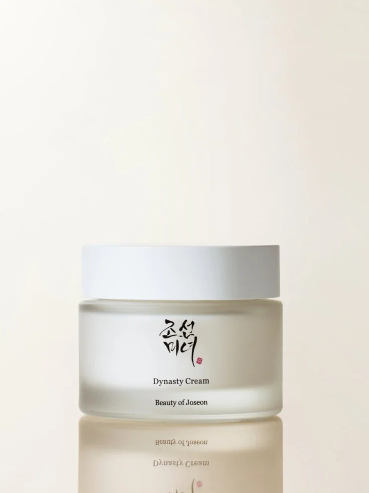 A close-up of the Beauty of Joseon Dynasty Cream jar, showcasing its luxurious texture and traditional hanbang-inspired packaging.