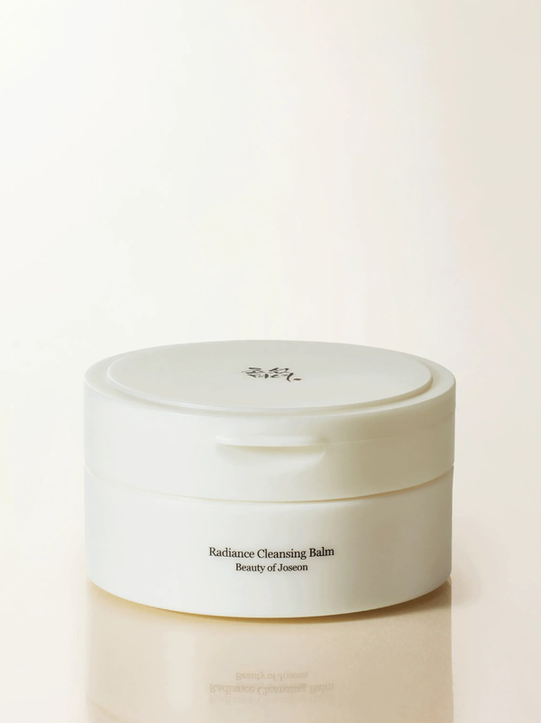 Beauty of Joseon Radiance Cleansing Balm 100ml tub showcasing its solid, white sherbet-like texture that melts into a silky oil upon skin contact.