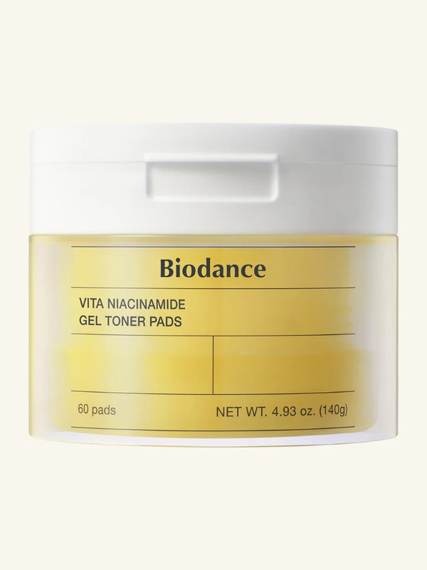 Biodance Vita Niacinamide Gel Toner Pads 60ea jar displayed on a bright, radiant background showcasing its signature yellow packaging.
