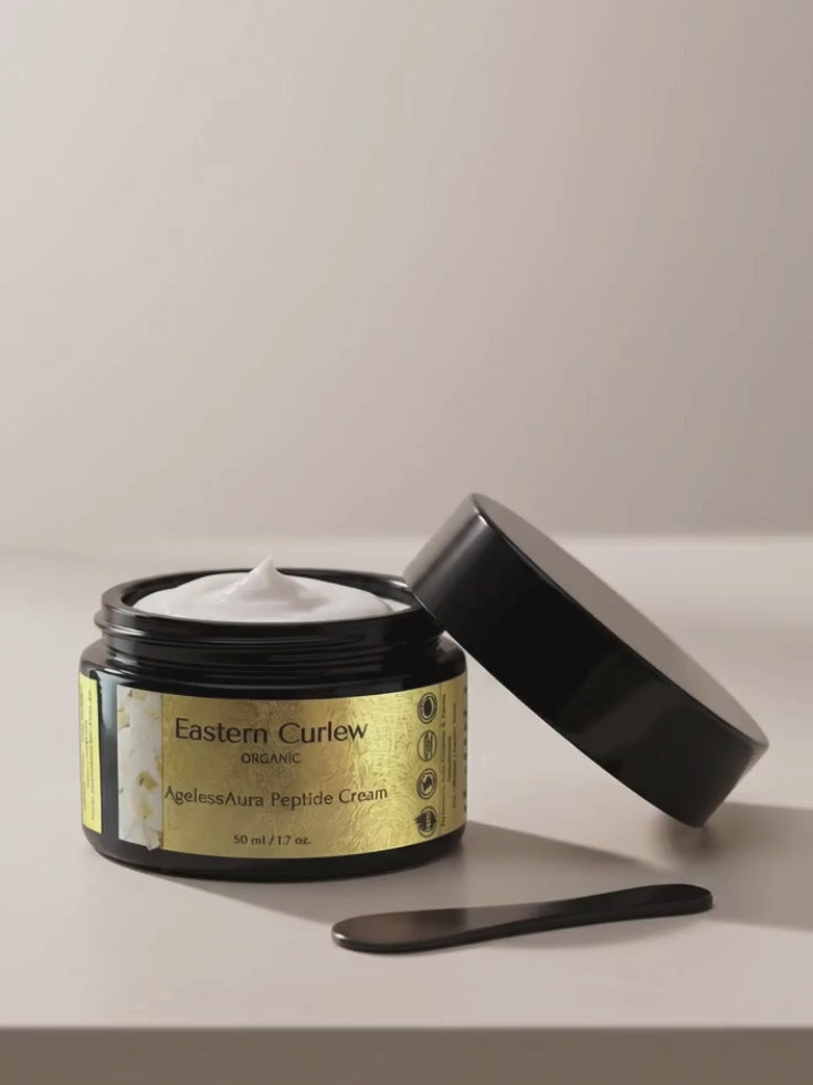 Spatula scooping the rich, whipped texture of AgelessAura Peptide Cream by Eastern Curlew